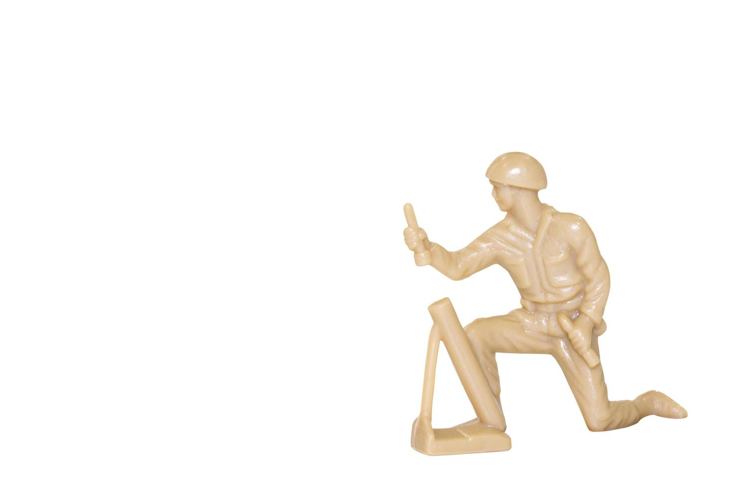 Miniature toy soldier on a white background photo