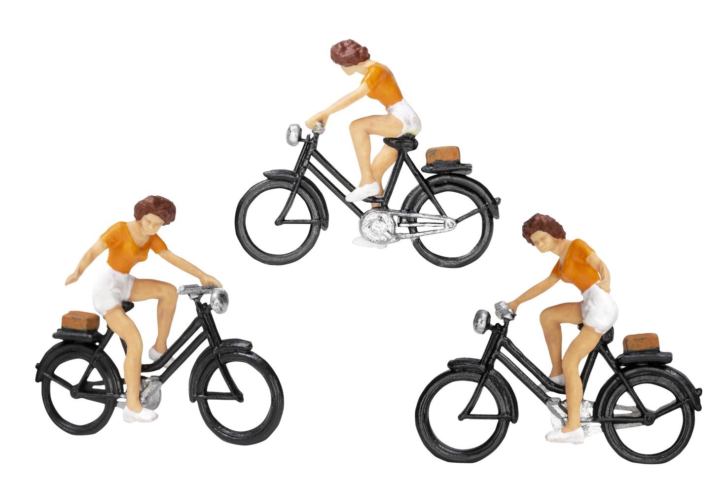 Miniature travelers with bicycles isolated on a white background photo