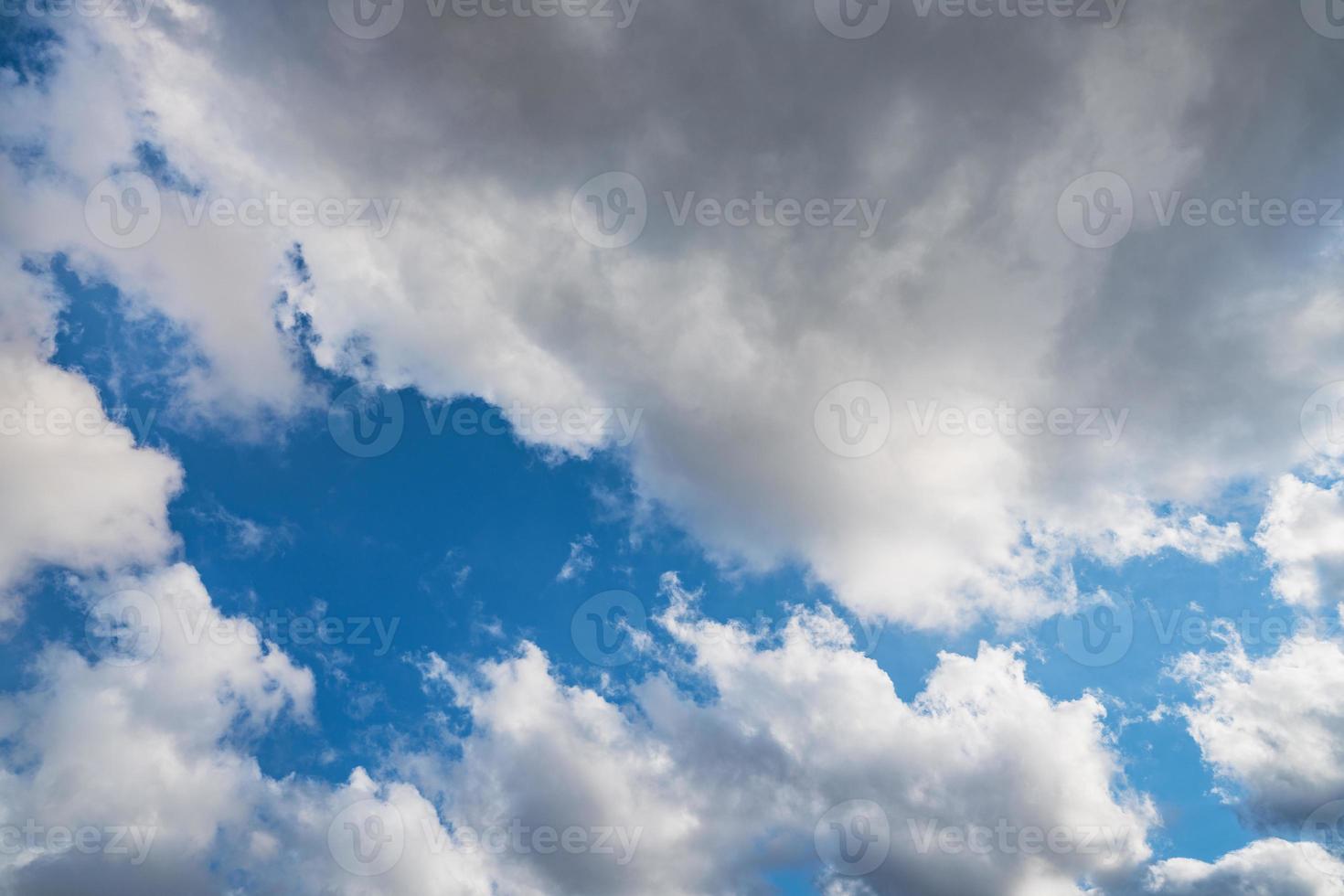 Cumulus clouds in a blue sky photo