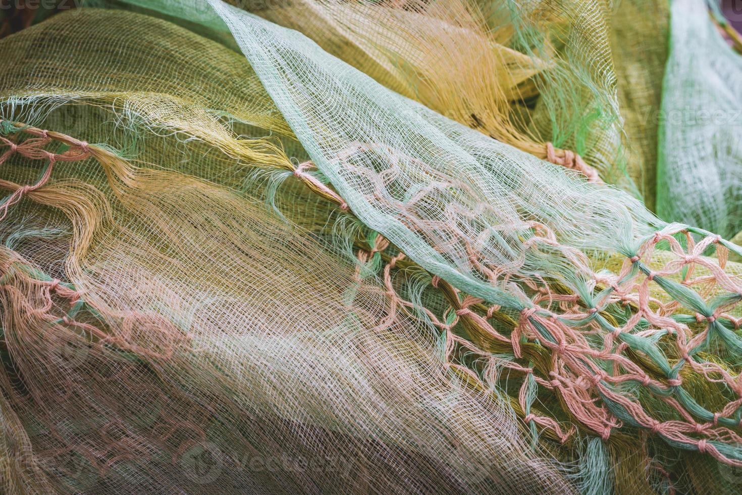 Macrame knots decorating a crumpled shawl photo