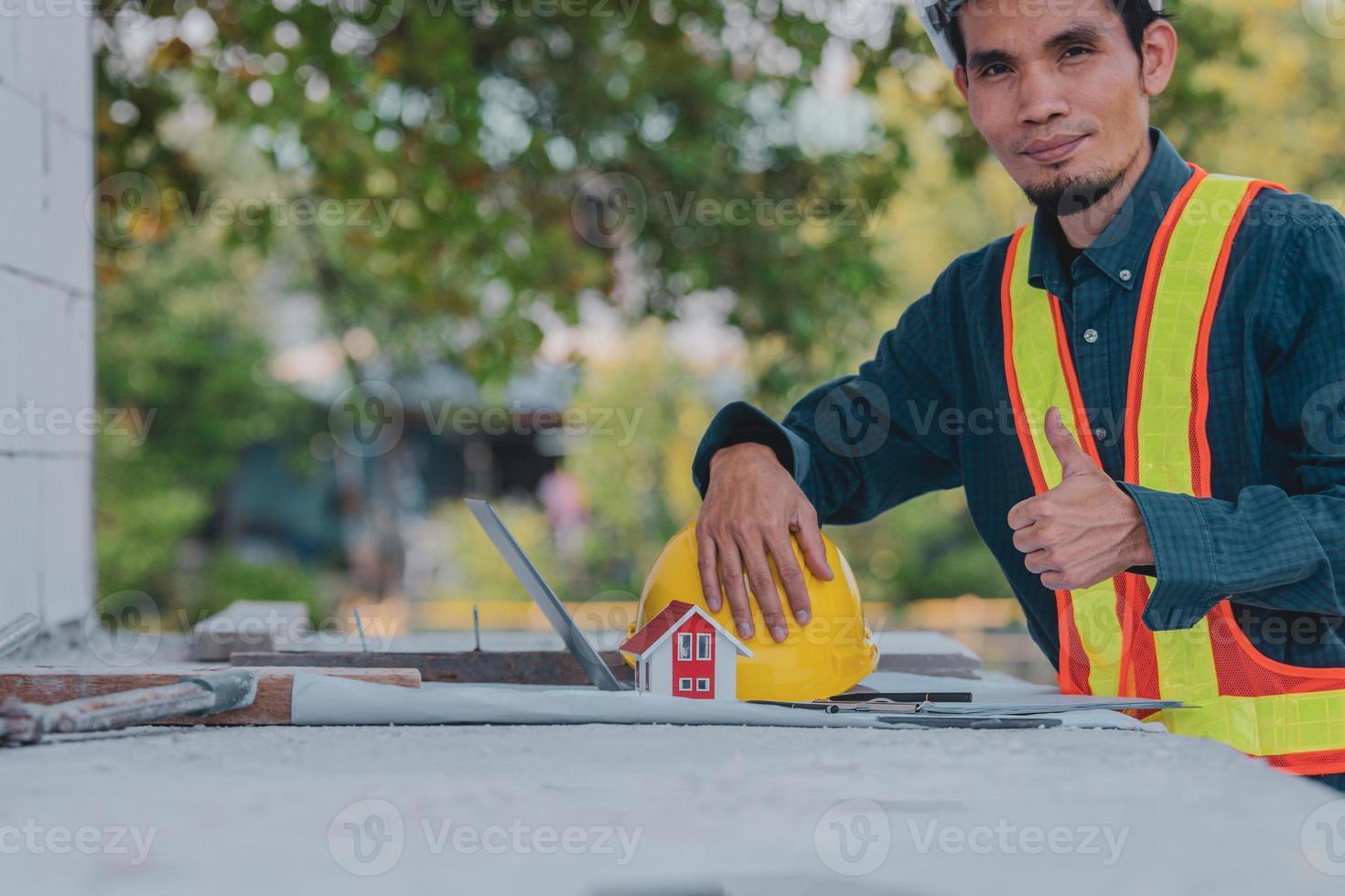 Architectural Engineer designs building construction for a house project photo