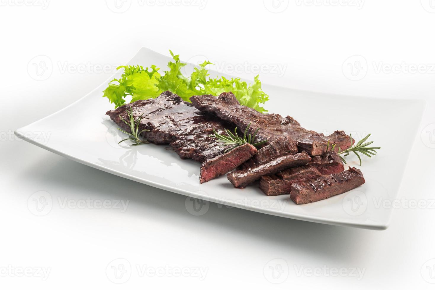 Meat dish skirt steak and salad photo