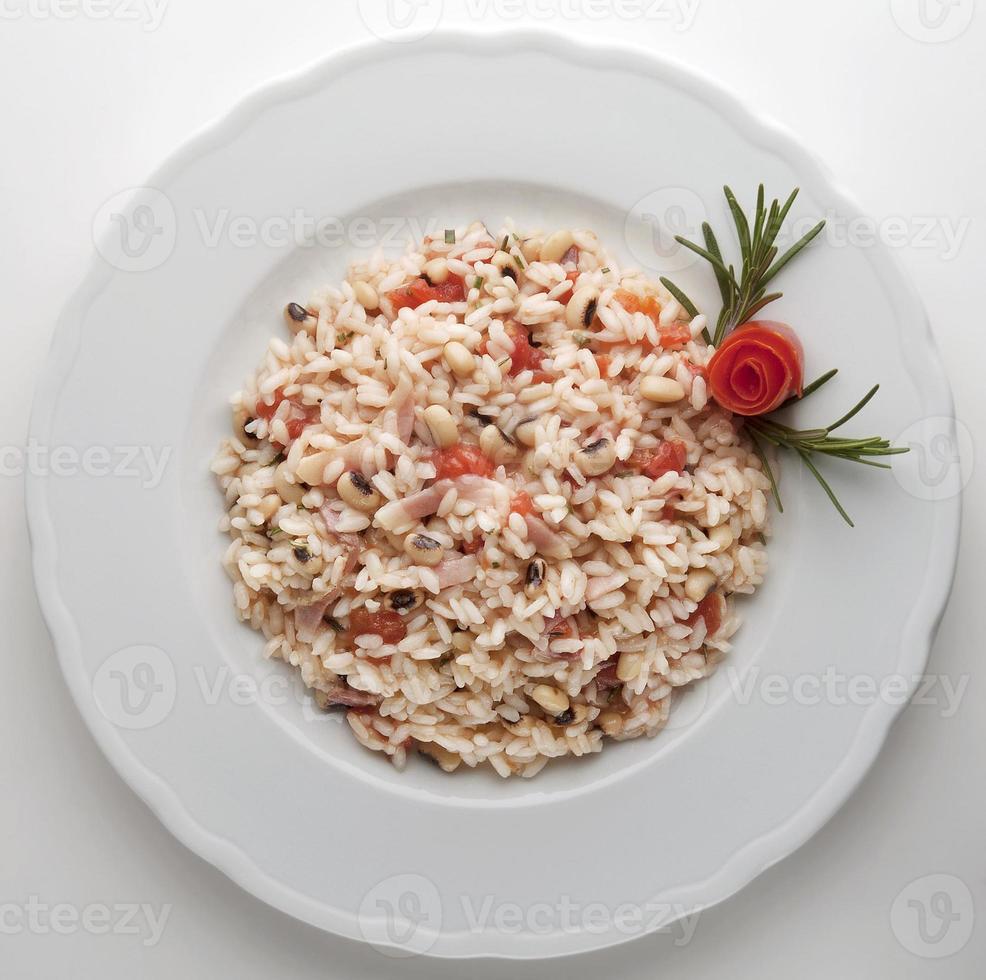 Risotto with bacon, beans and tomato photo