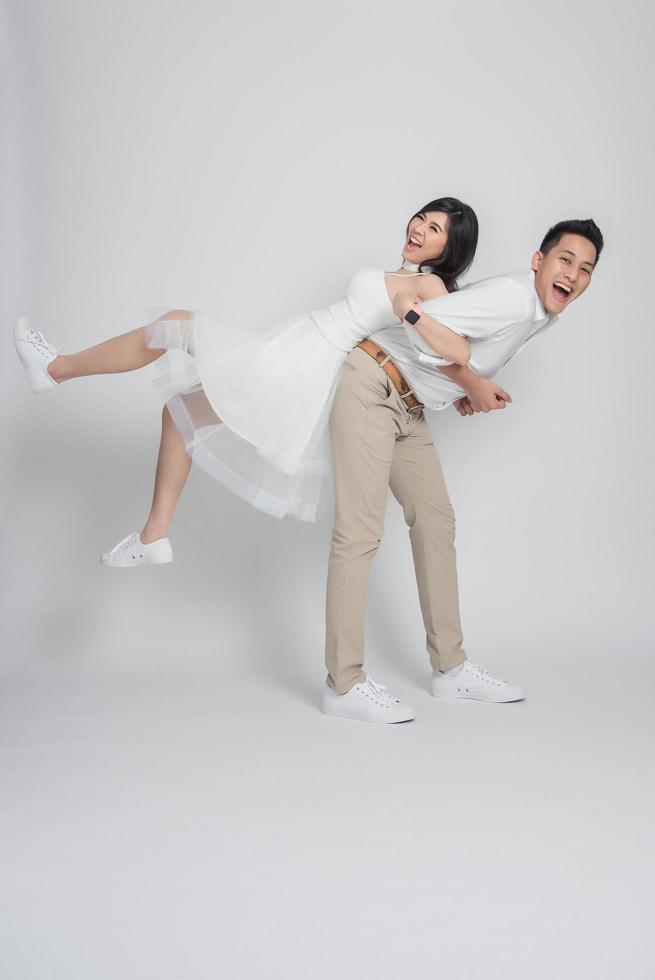 Happy Asian couple having fun photo