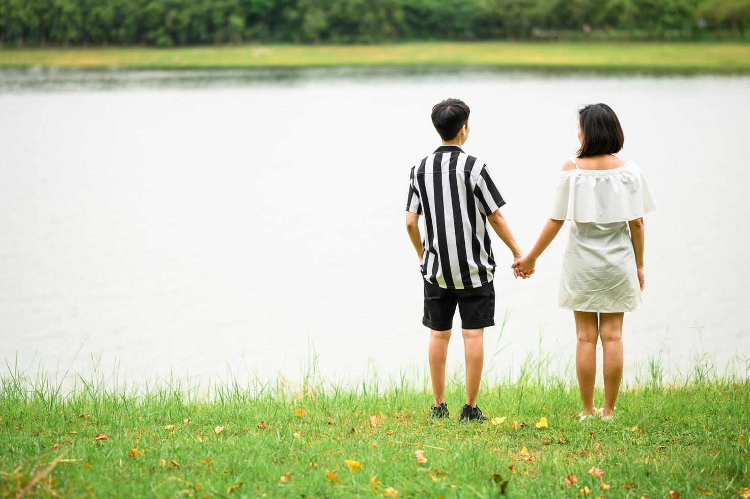 LGBT Asian women holding hands photo