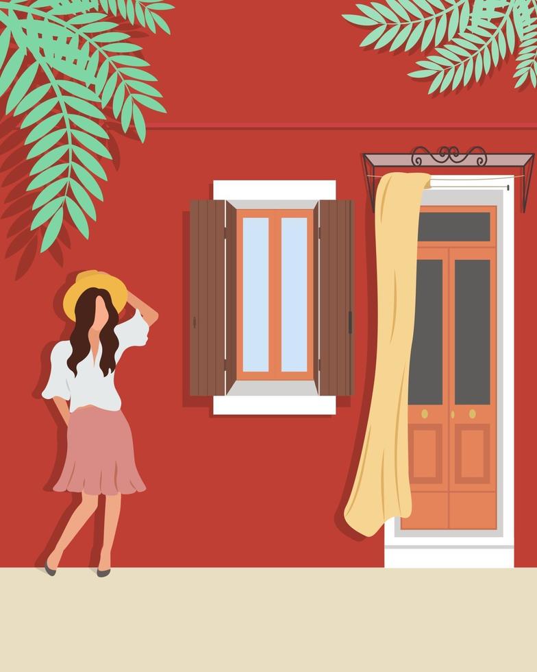 Woman in a hat stands against the wall of the house vector