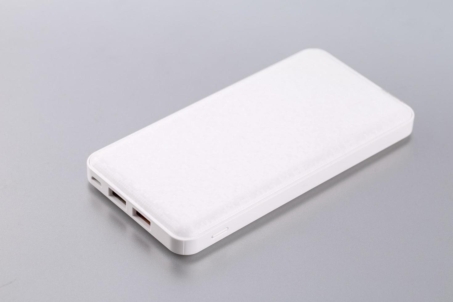 White power bank on a gray background photo