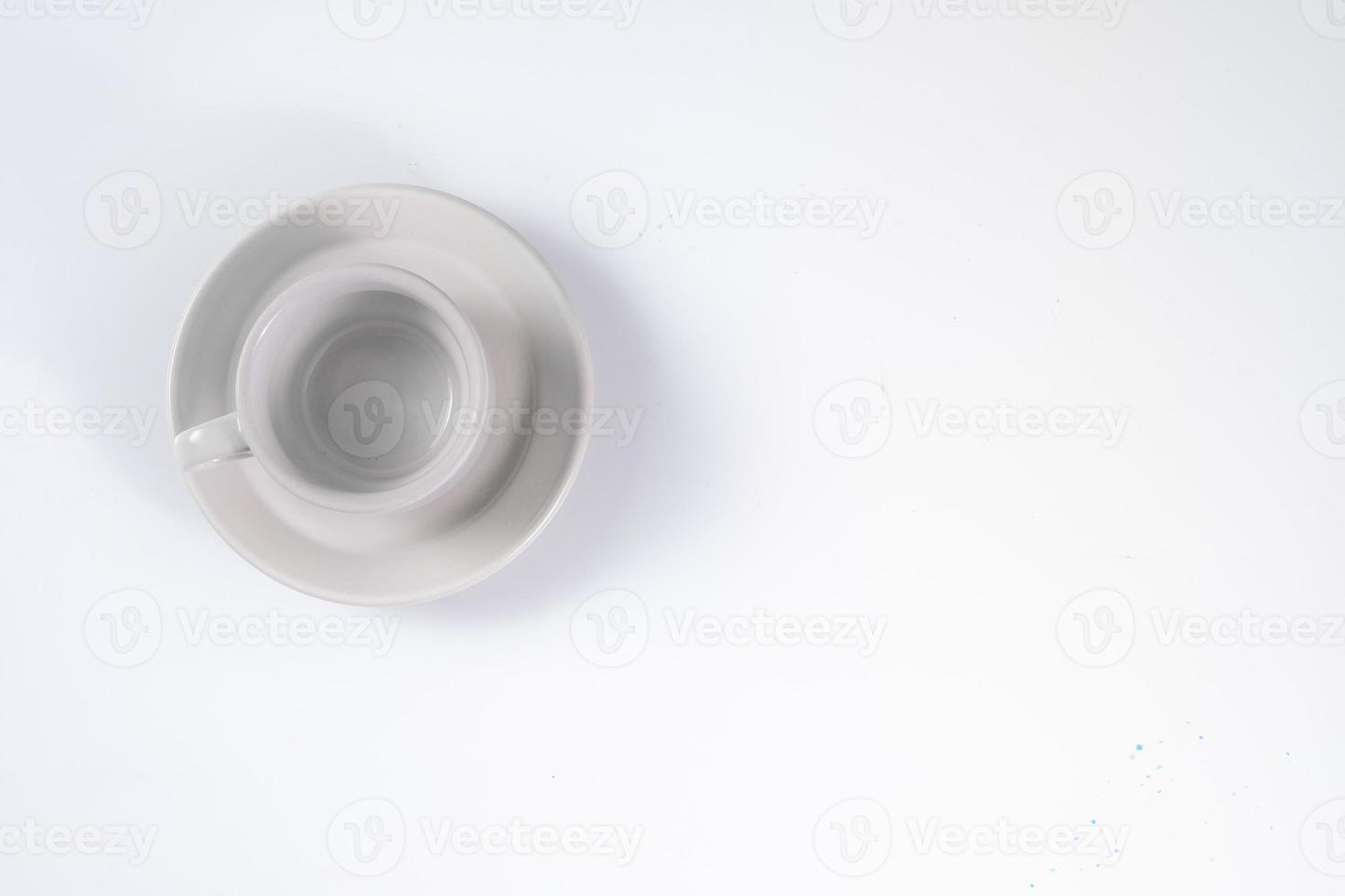 Empty white coffee cup on white background photo