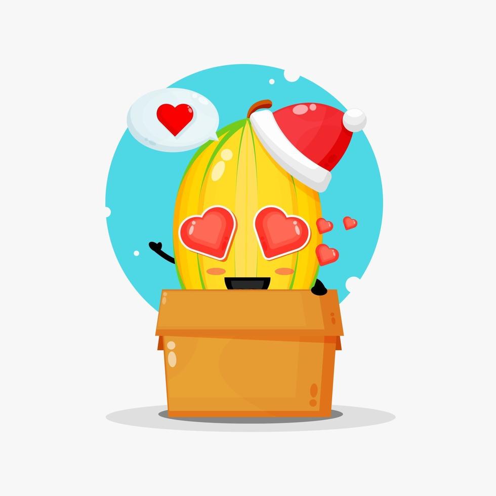 linda mascota de carambola en una caja con un sombrero de navidad vector