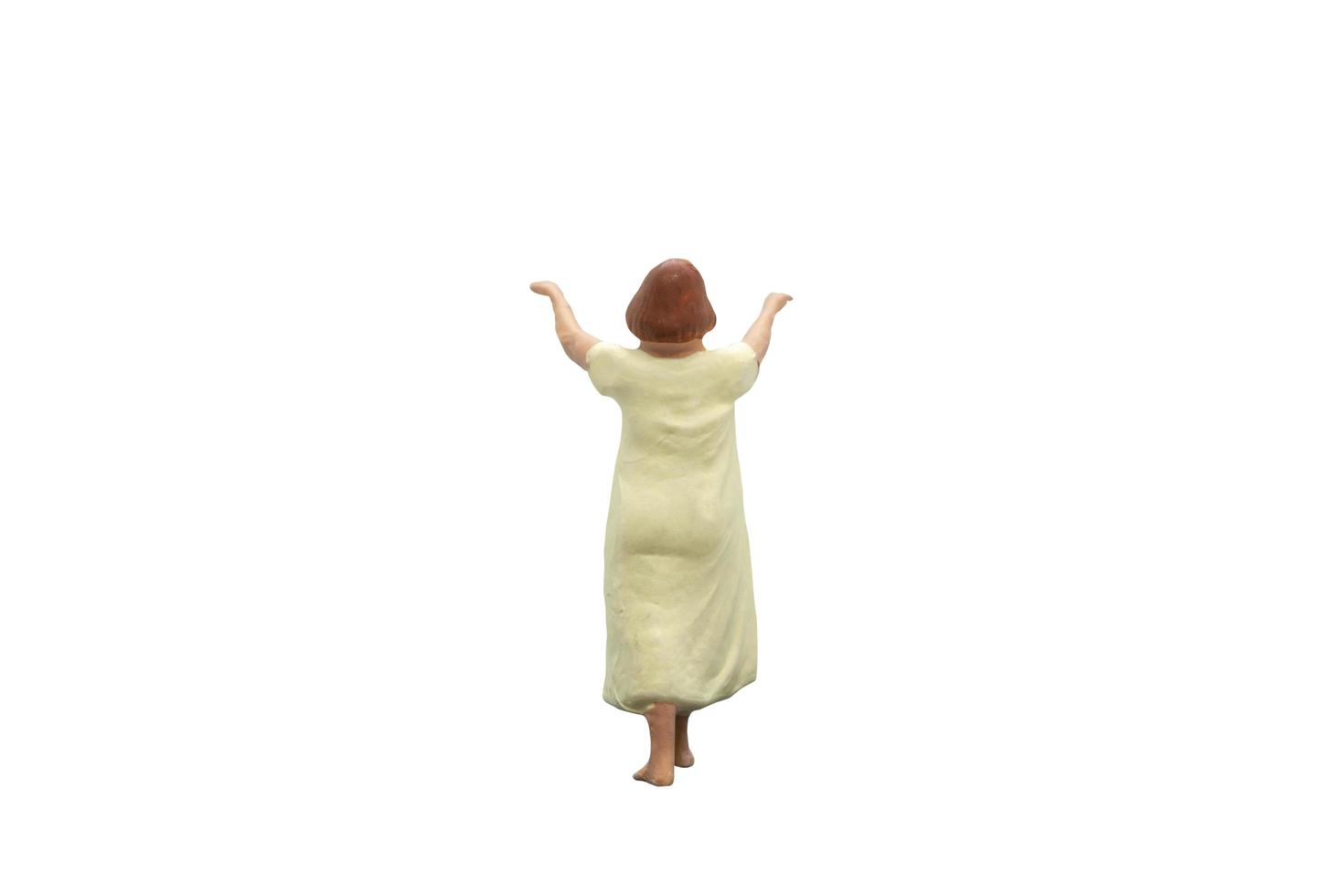 Miniature person sleepwalking isolated on a white background photo