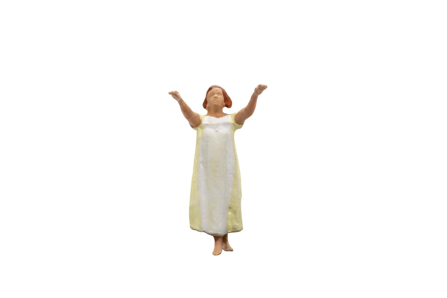 Miniature person sleepwalking isolated on a white background photo