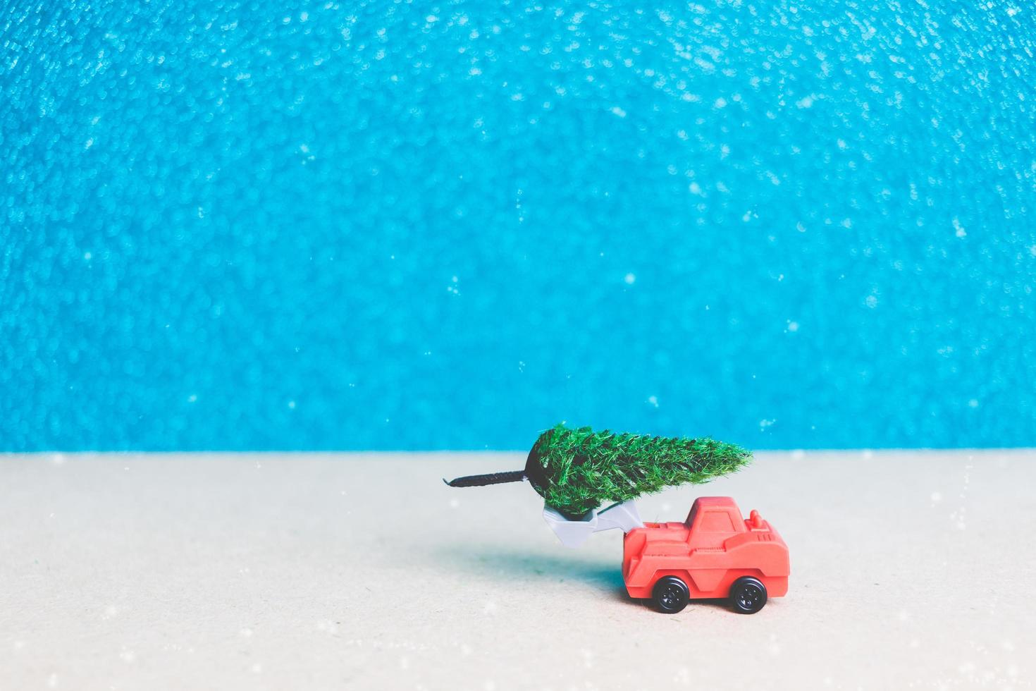 Christmas tree on a miniature car, Christmas season celebration concept photo