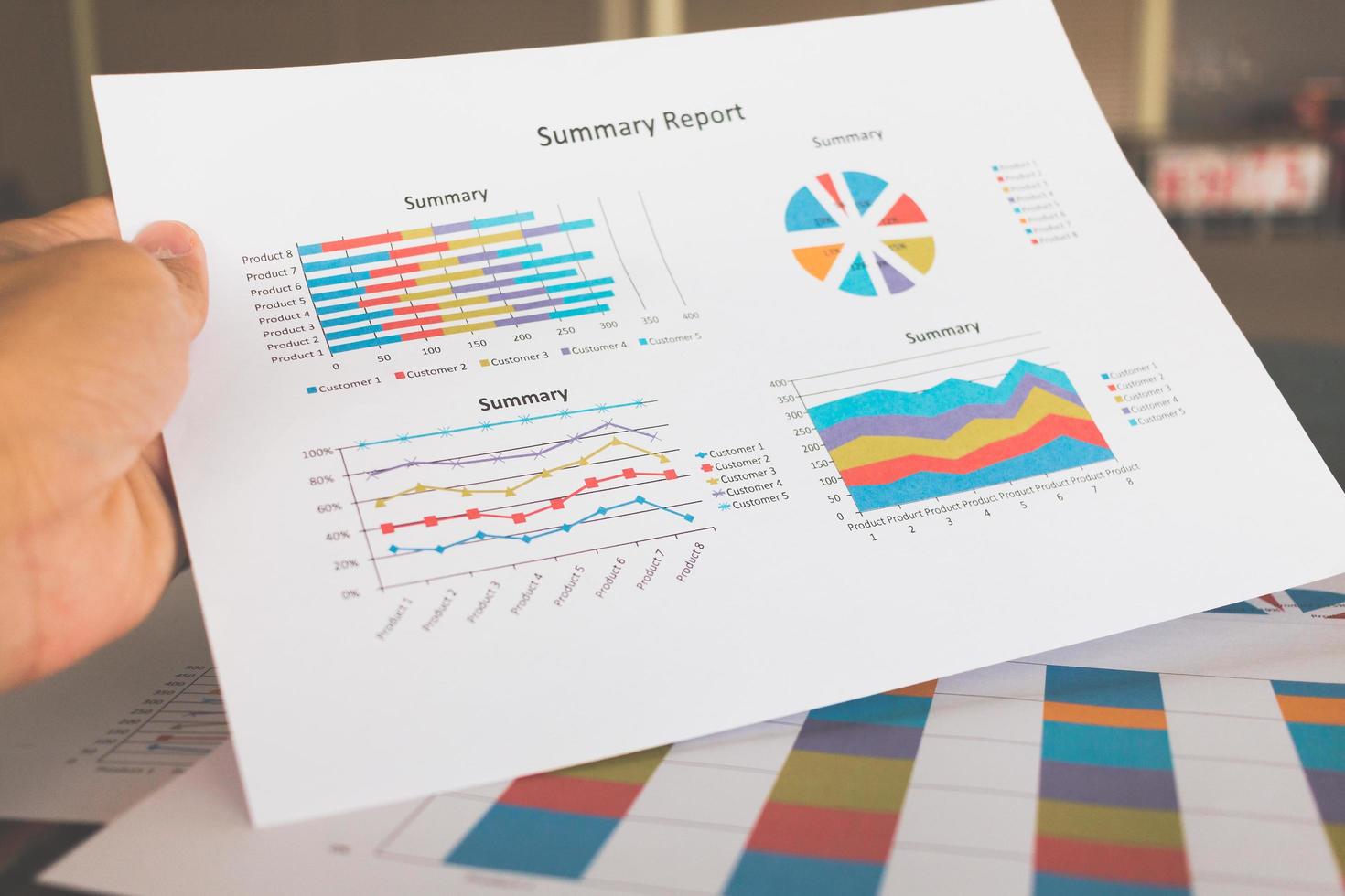 Financial graphs and charts on a wooden table photo