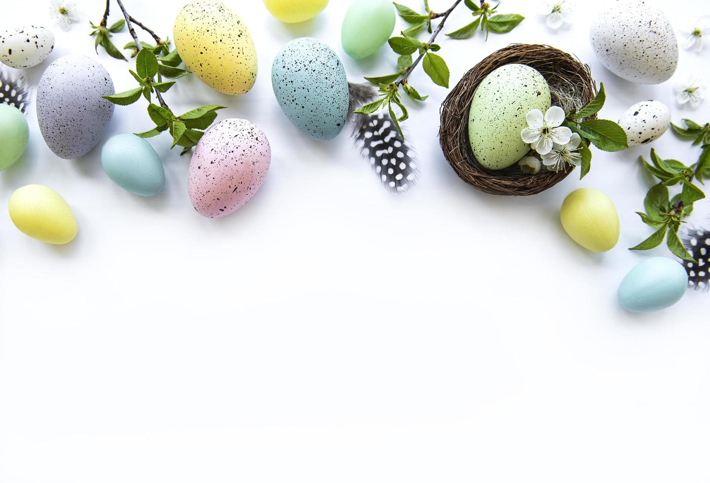 Colorful Easter eggs with spring blossom flowers photo