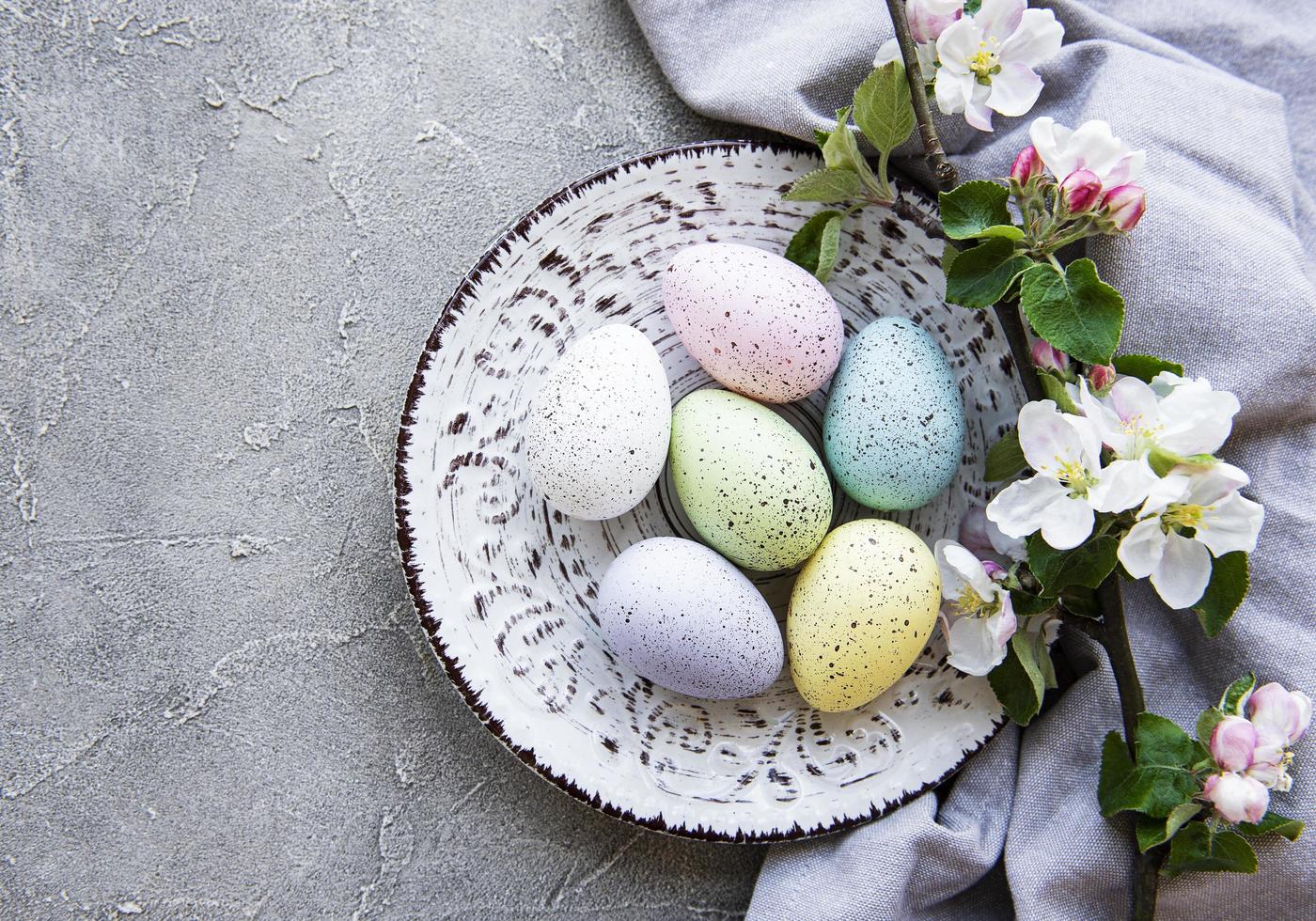 Colorful Easter eggs with spring blossom flowers photo