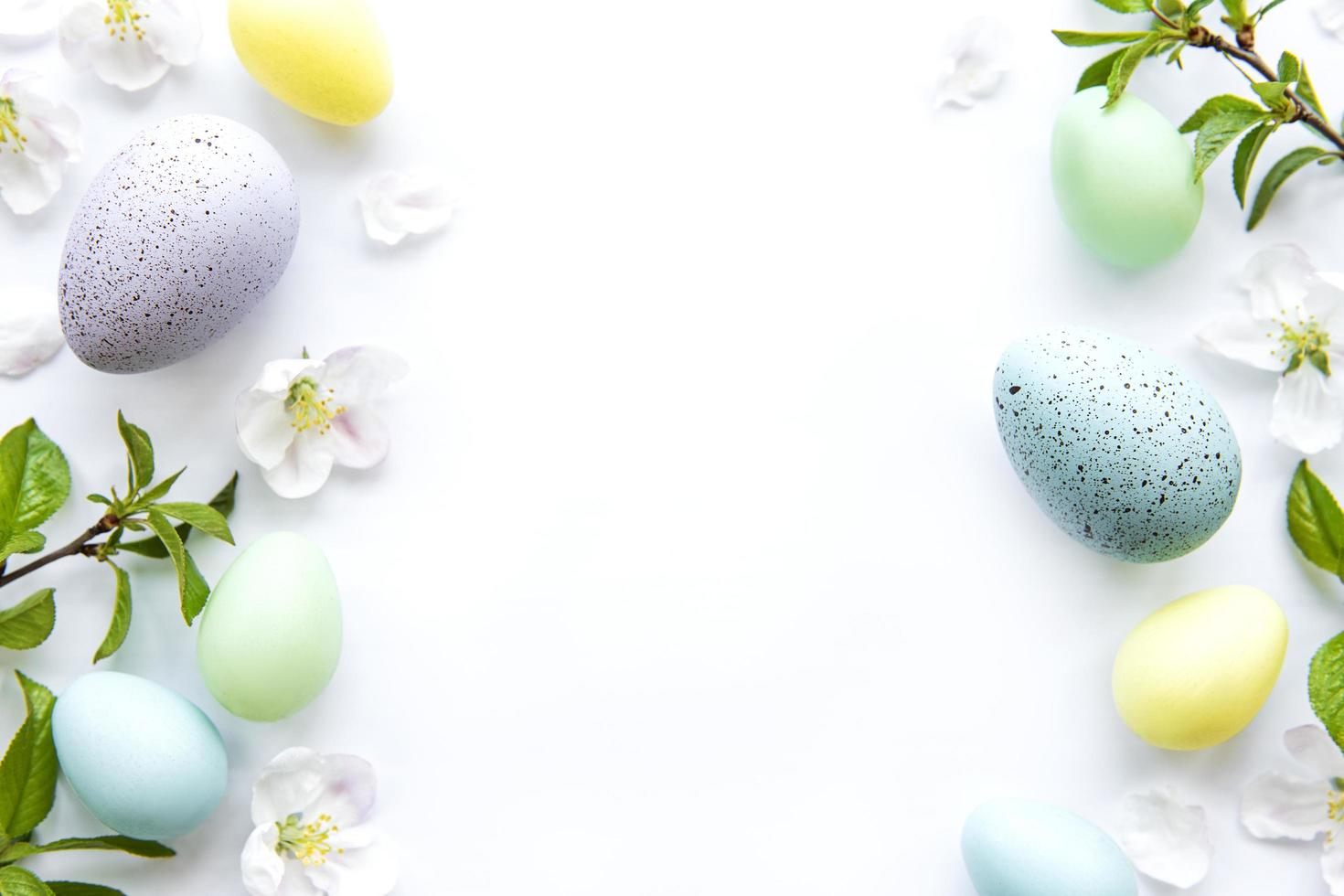 Colorful Easter eggs with spring blossom flowers photo