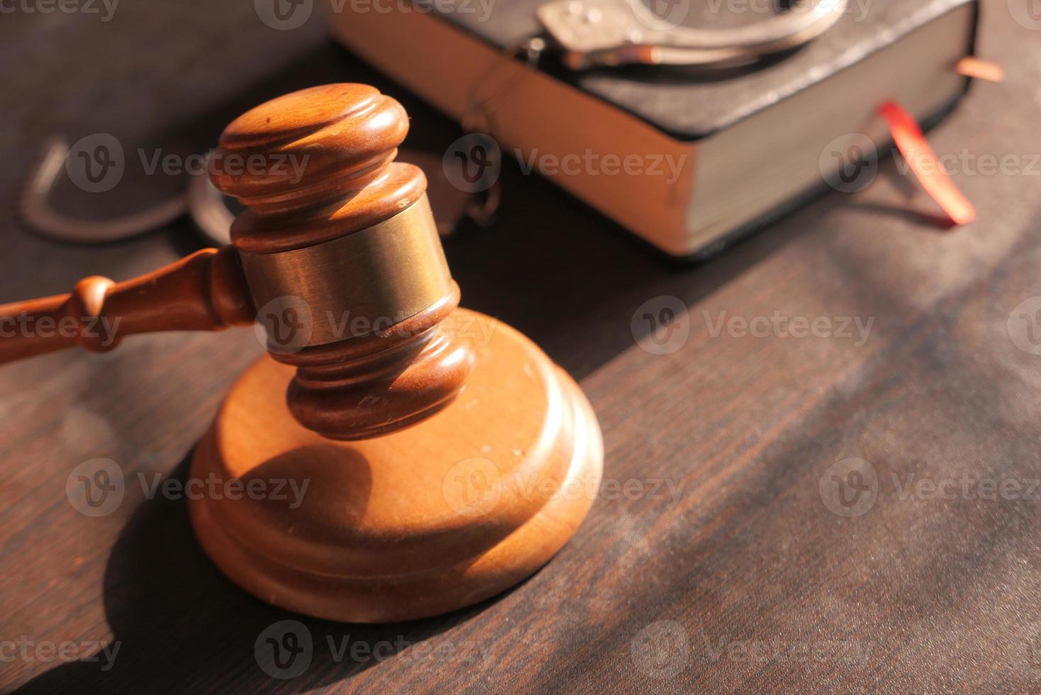 Gavel and book on table close up photo