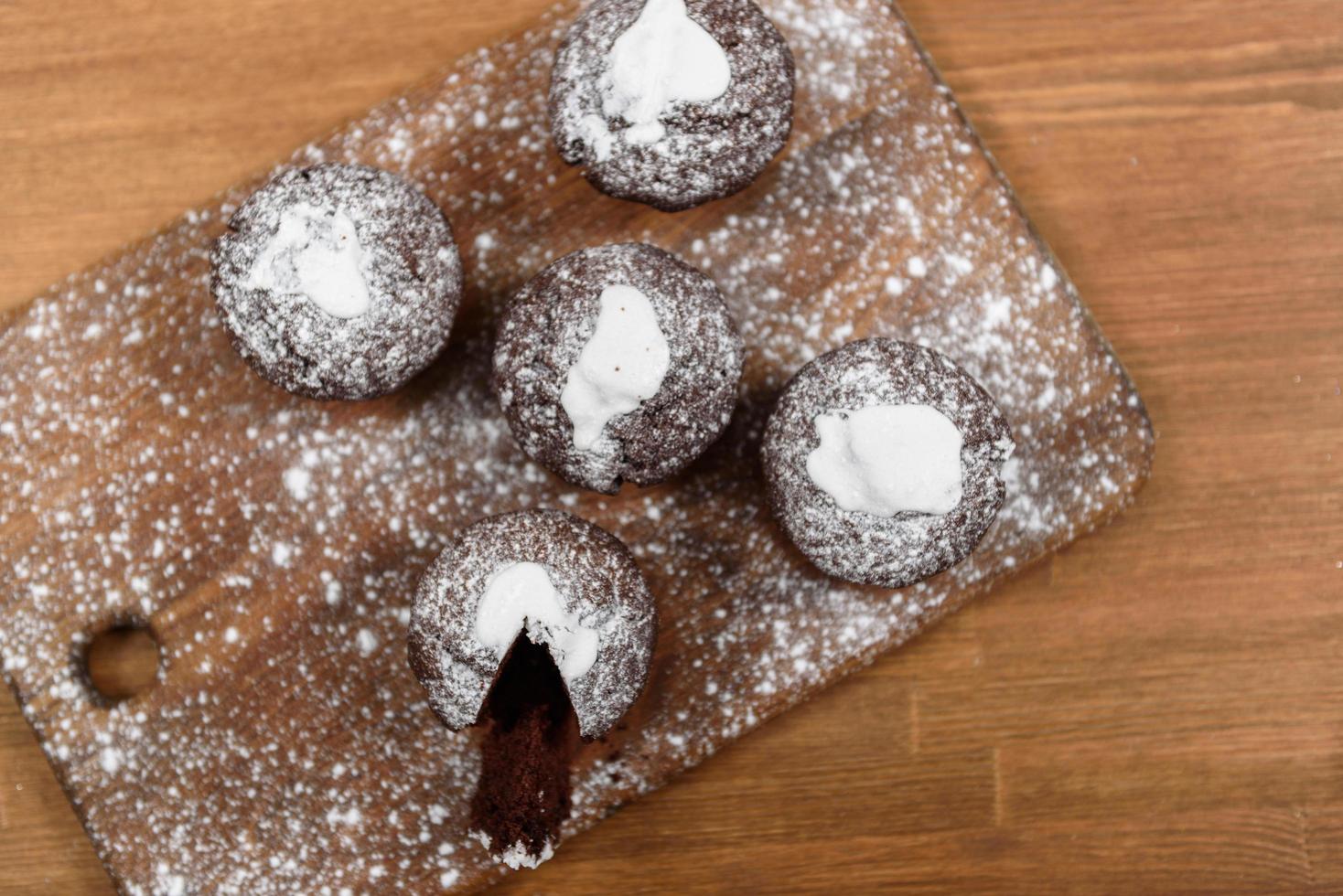 Chocolate muffins on the wood board photo