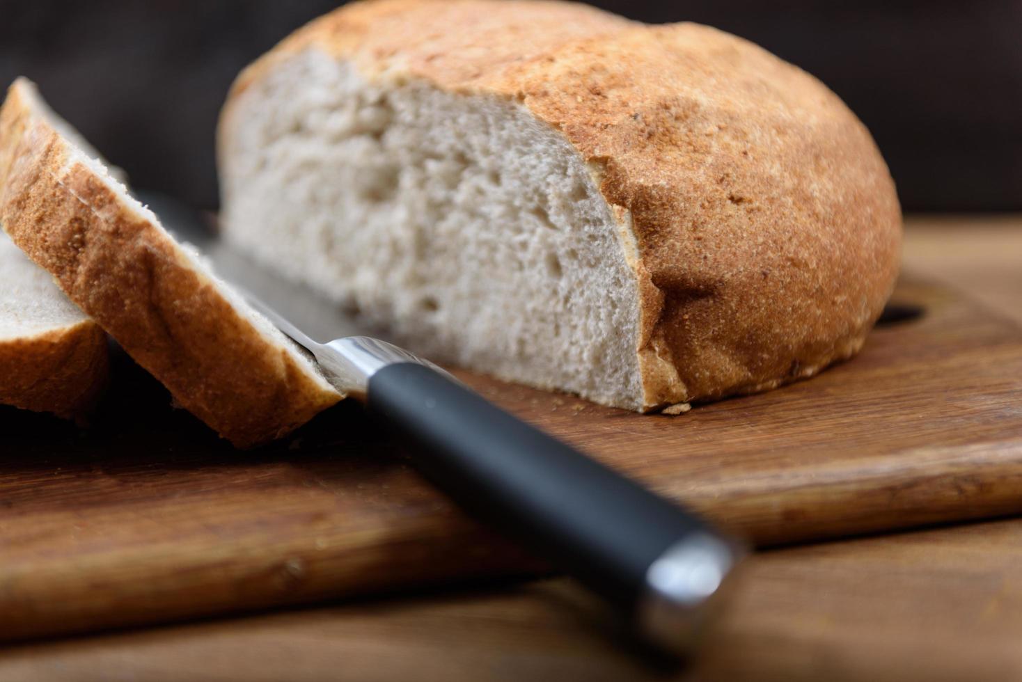 Grain bread on the wood board photo