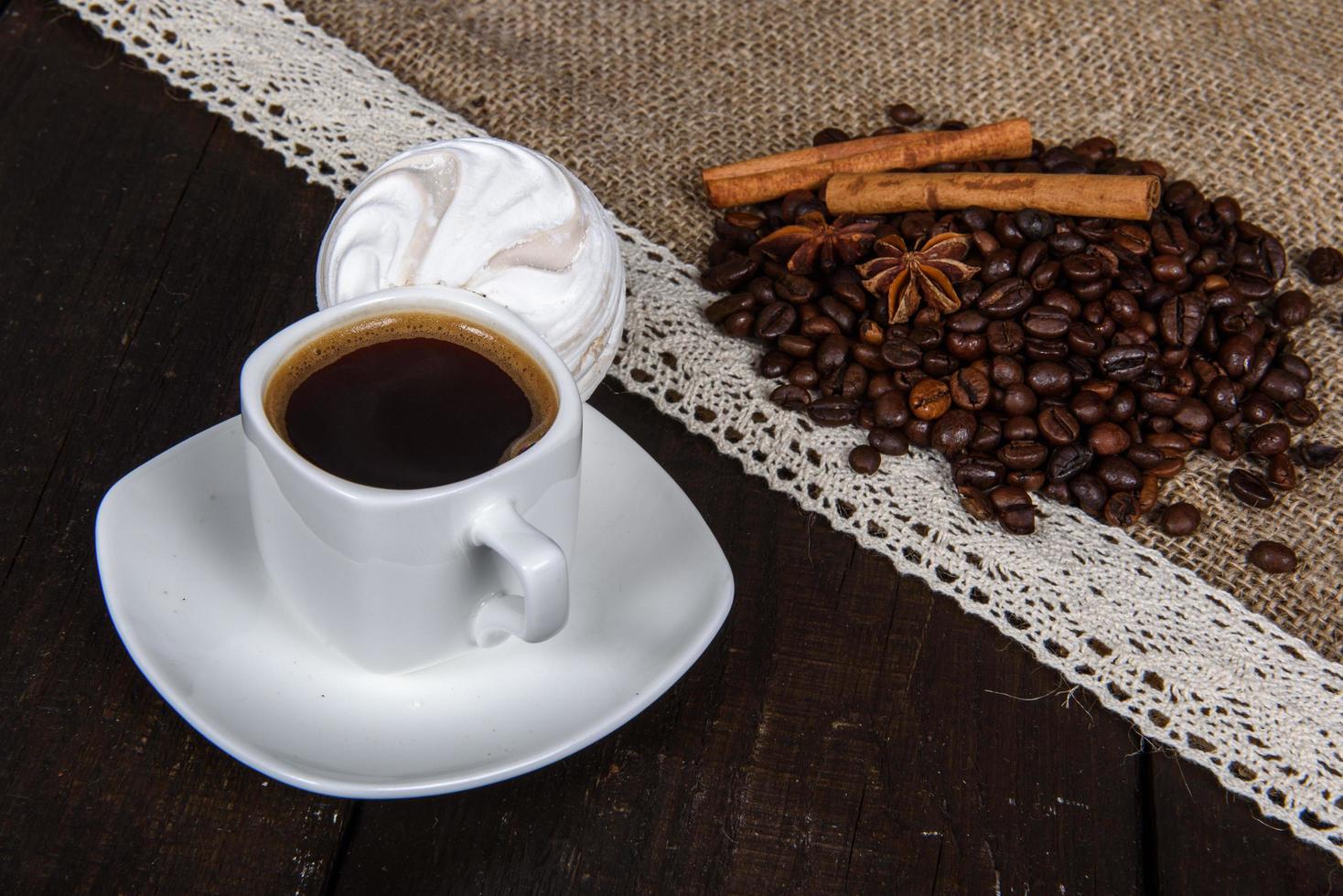 Black coffee with grains and cinnamon photo