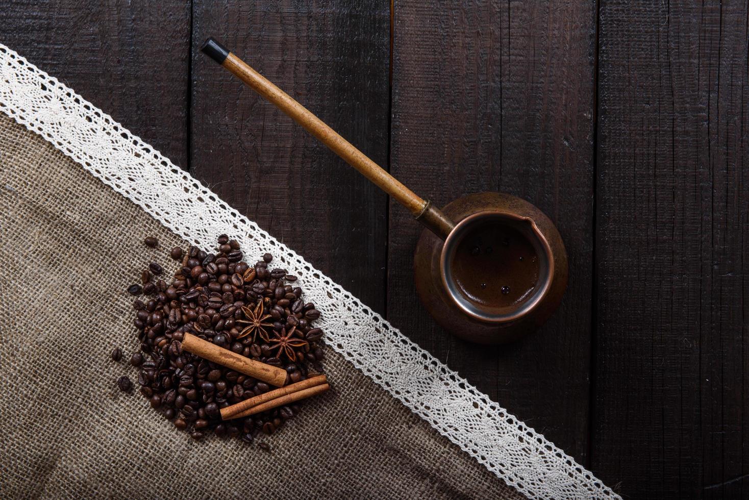 Black coffee with grains and cinnamon photo