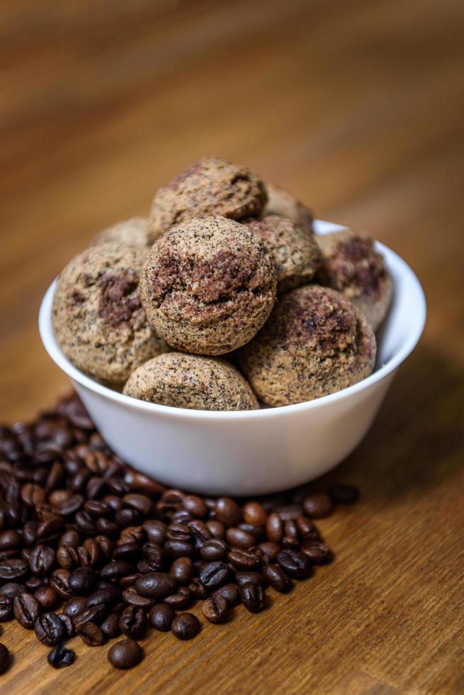 Coffee cookies in a plate with sprinkled coffee beans photo