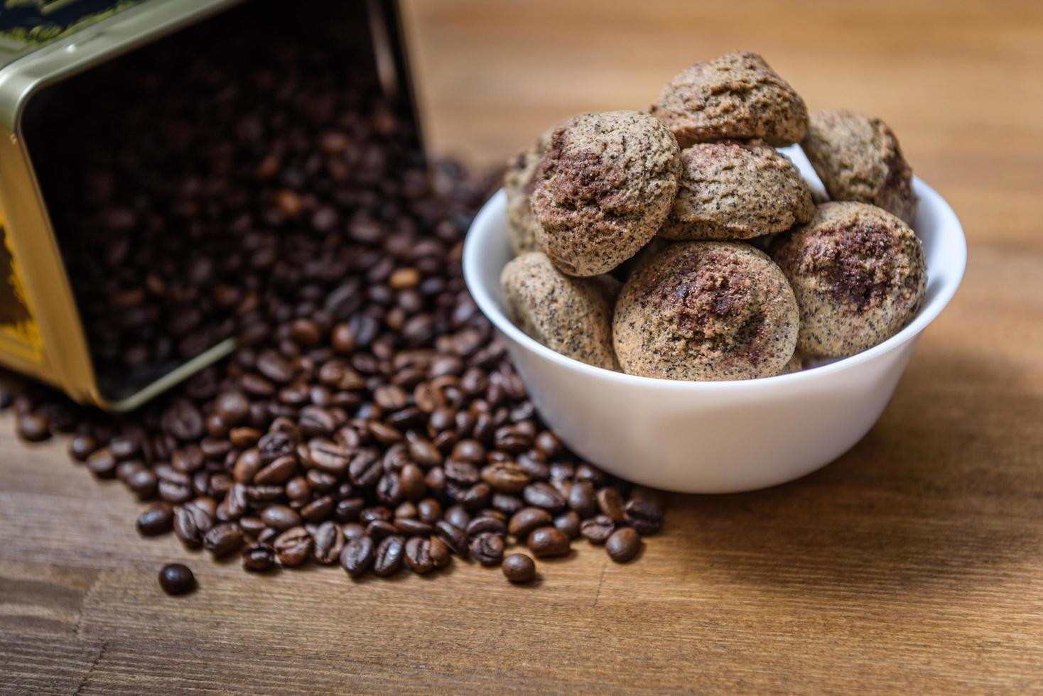 Coffee cookies in a plate with sprinkled coffee beans photo