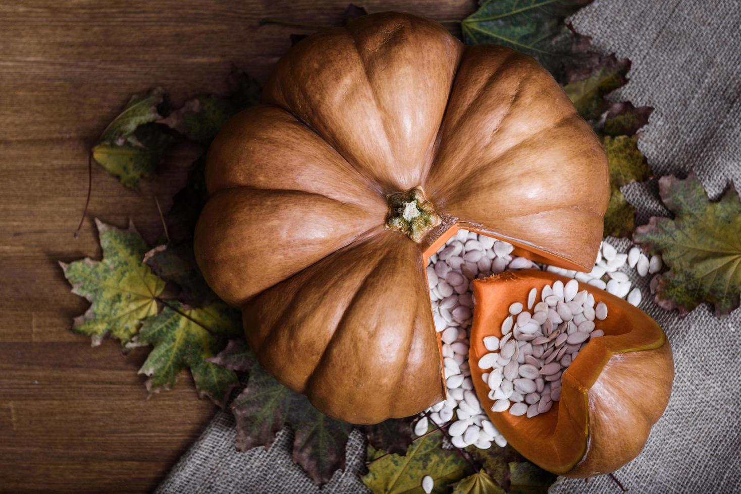 Pumpkin lying on a wooden table photo