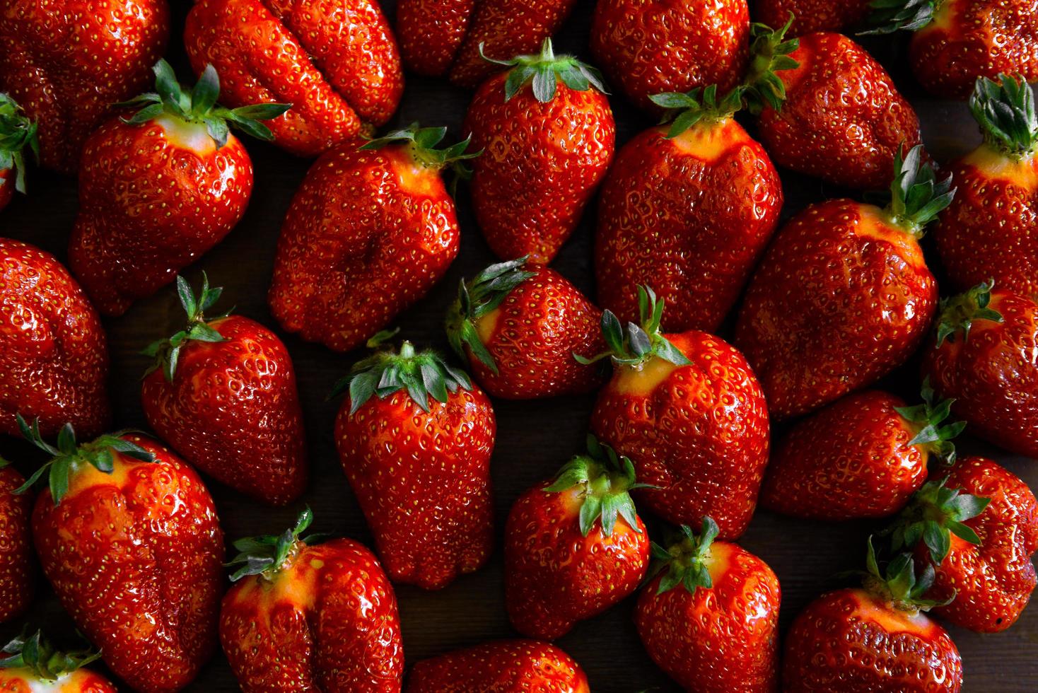 Strawberries on a wooden table photo