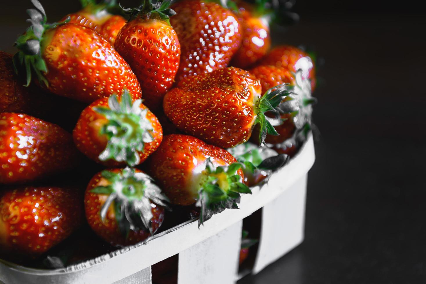 Strawberries on a wooden table photo