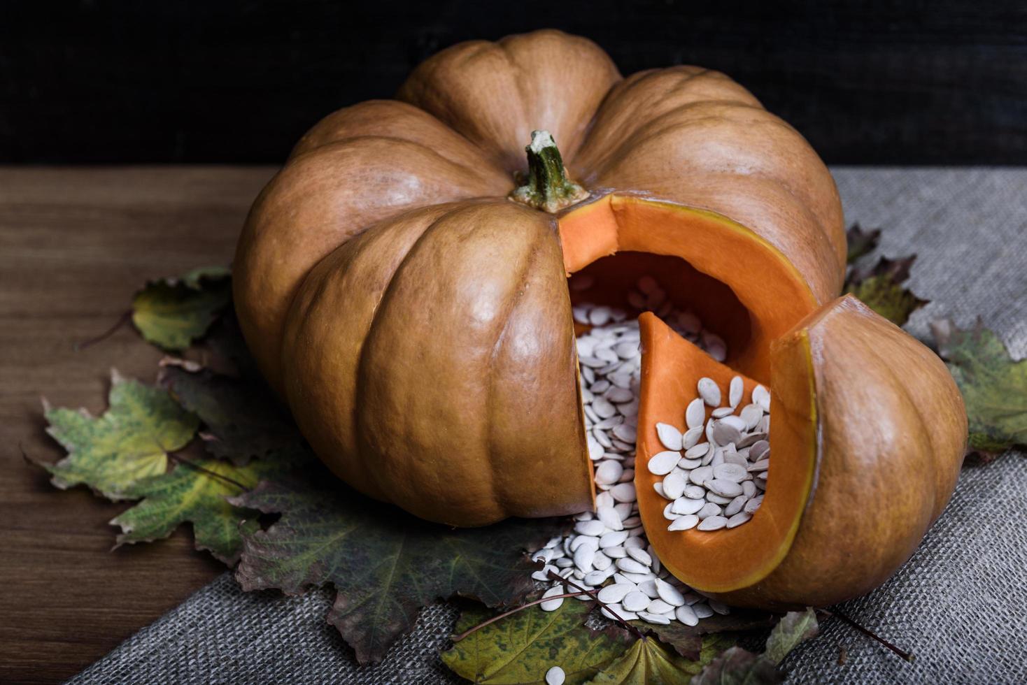 Pumpkin lying on a wooden table photo