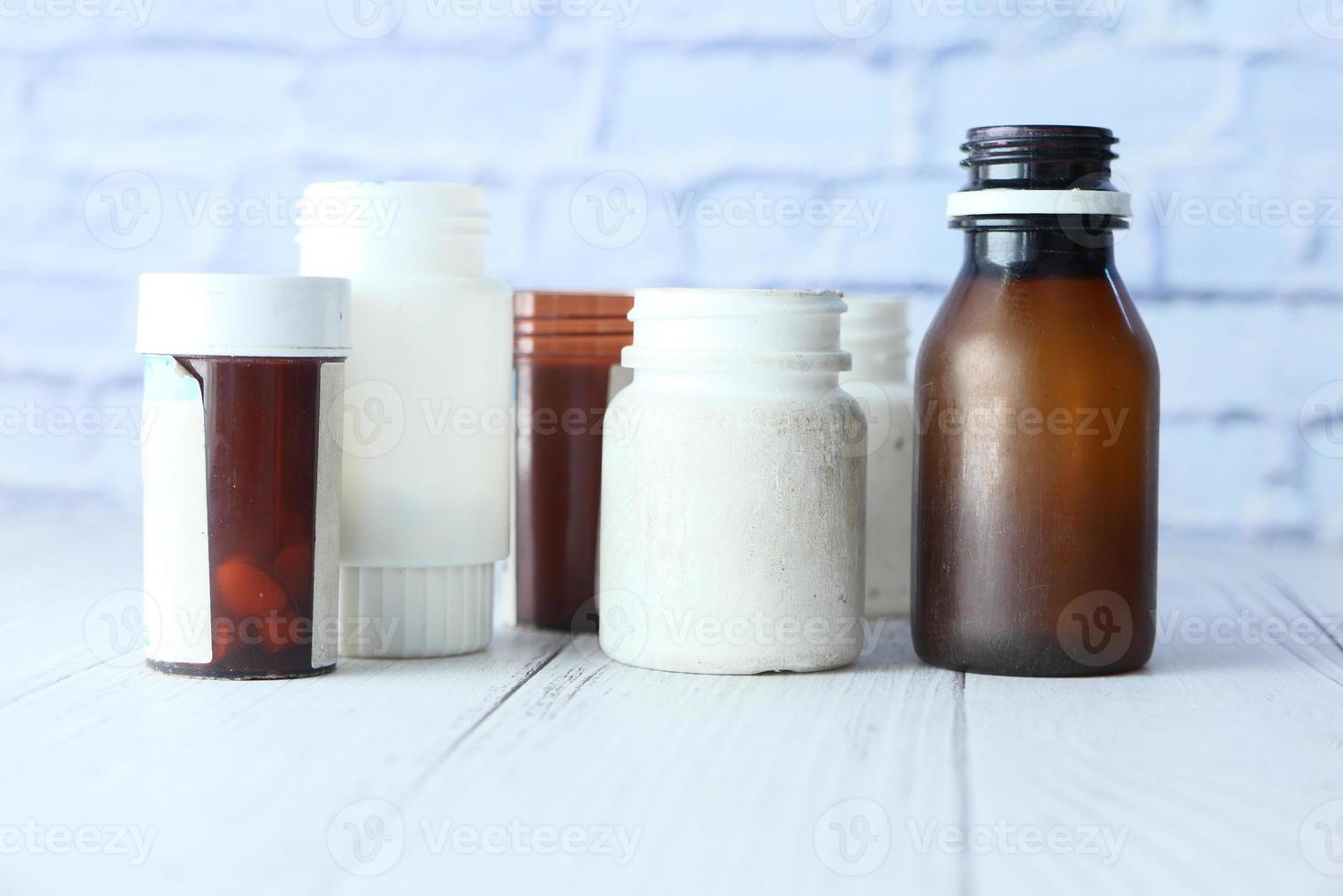 Empty unlabeled pill bottles photo