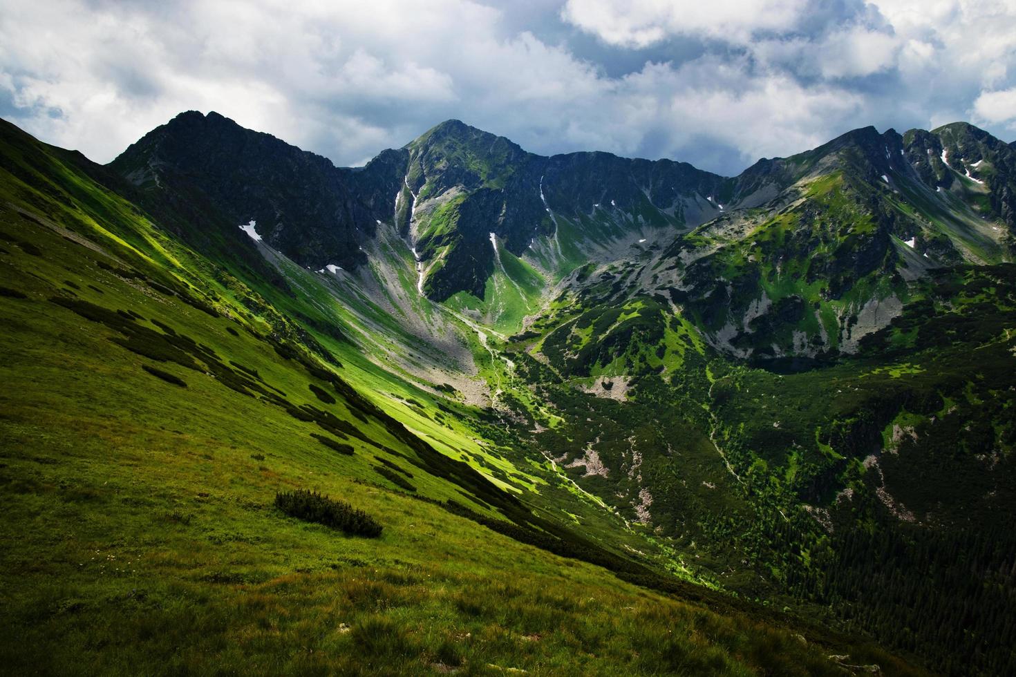 Green rocky mountain valley photo