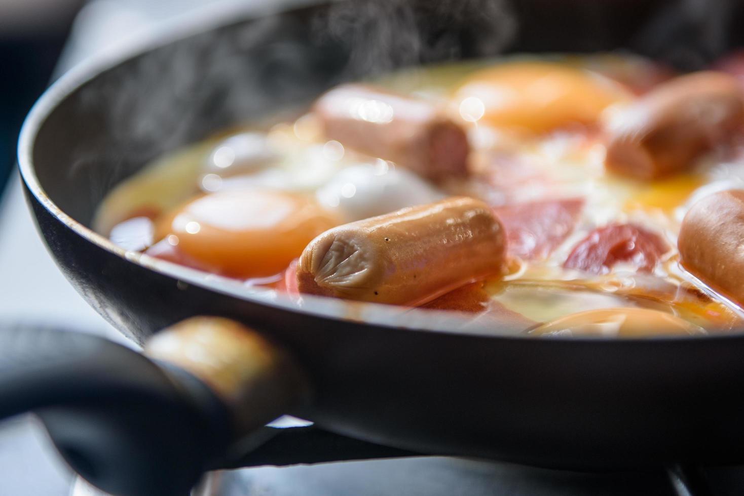 Fried eggs with sausages photo