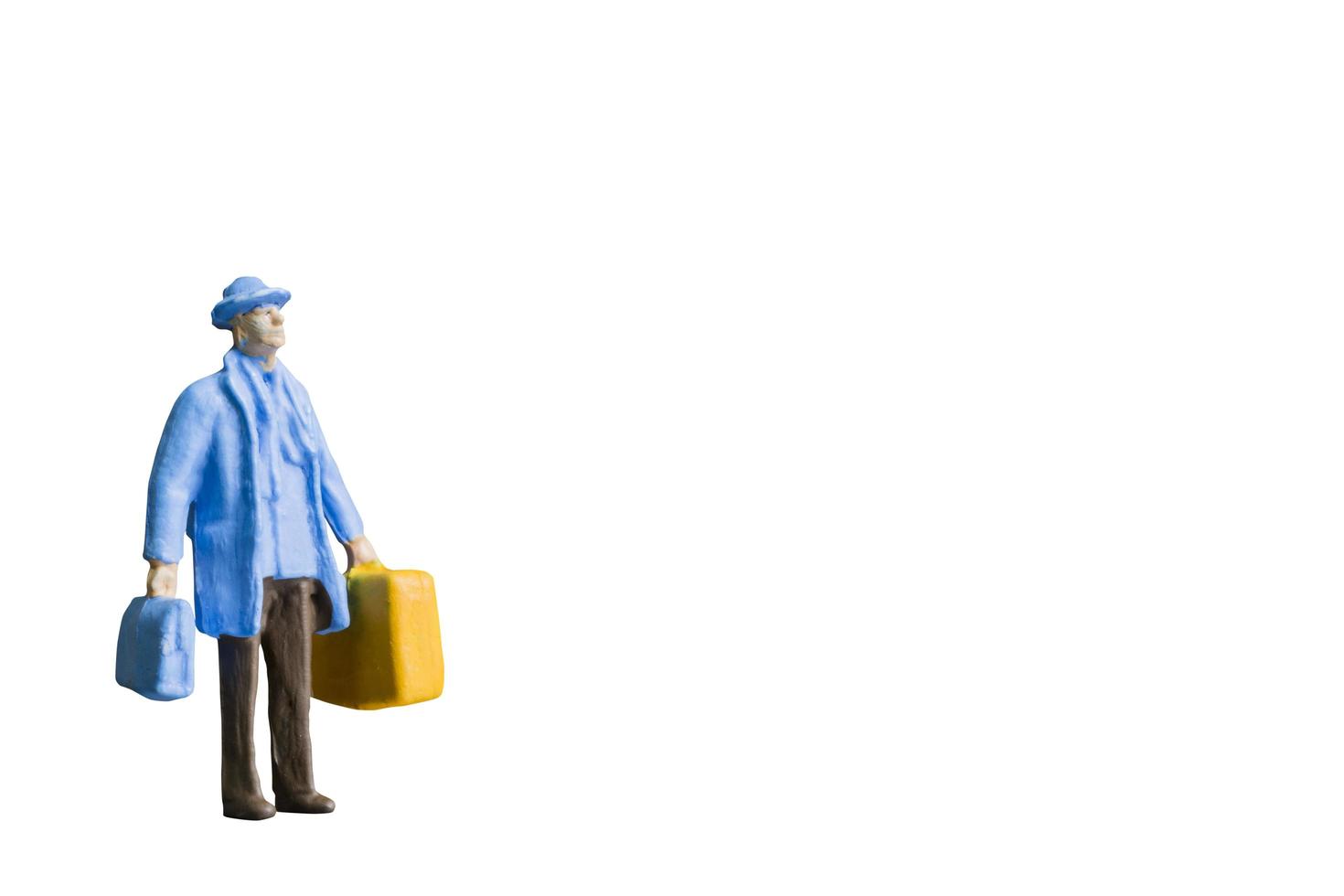 Miniature person isolated on a white background photo