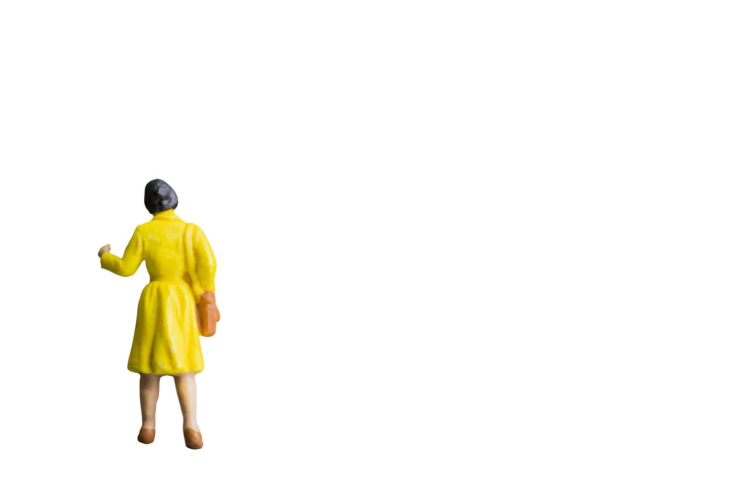 Miniature person isolated on a white background photo