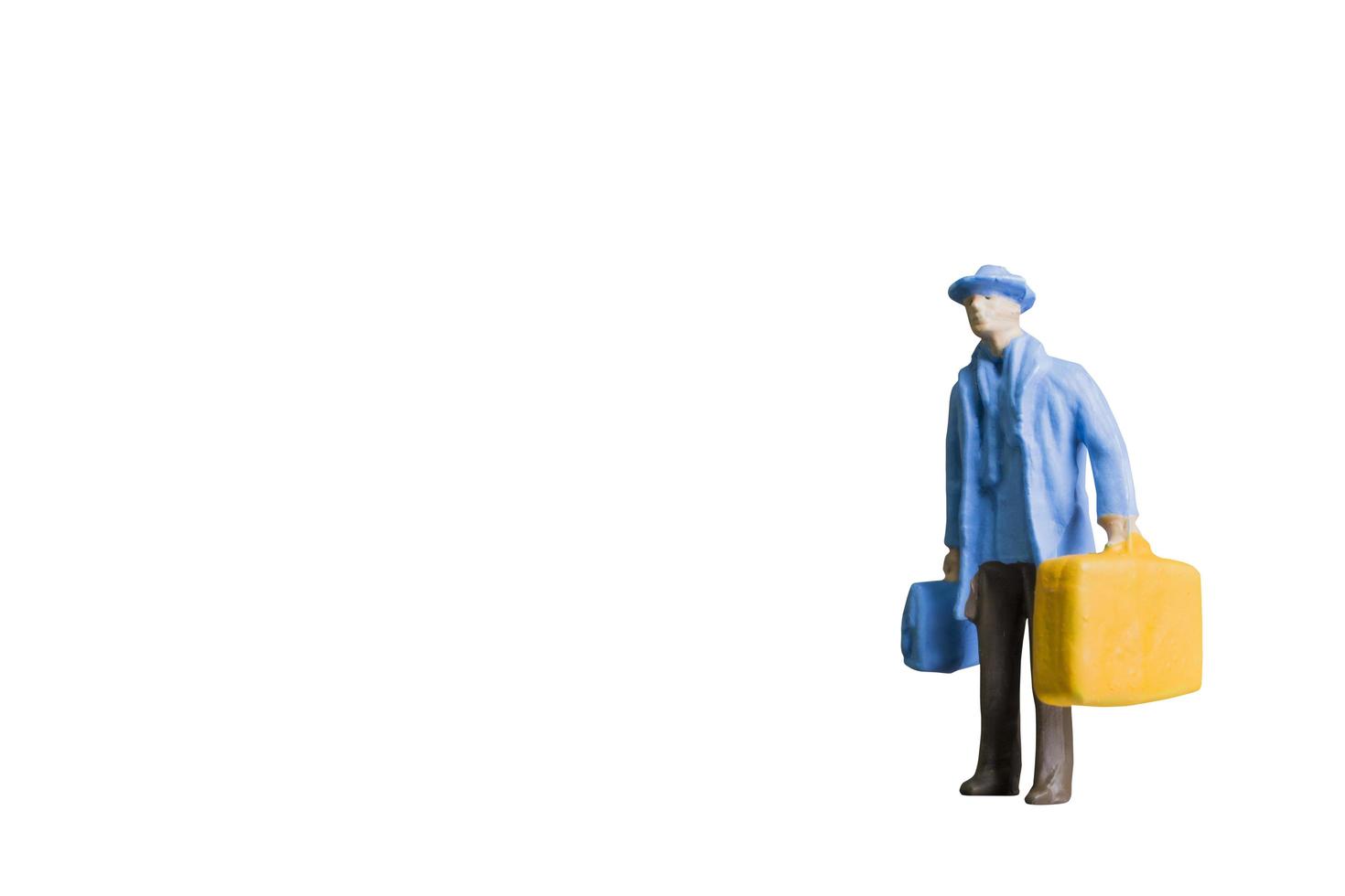 Miniature person isolated on a white background background photo