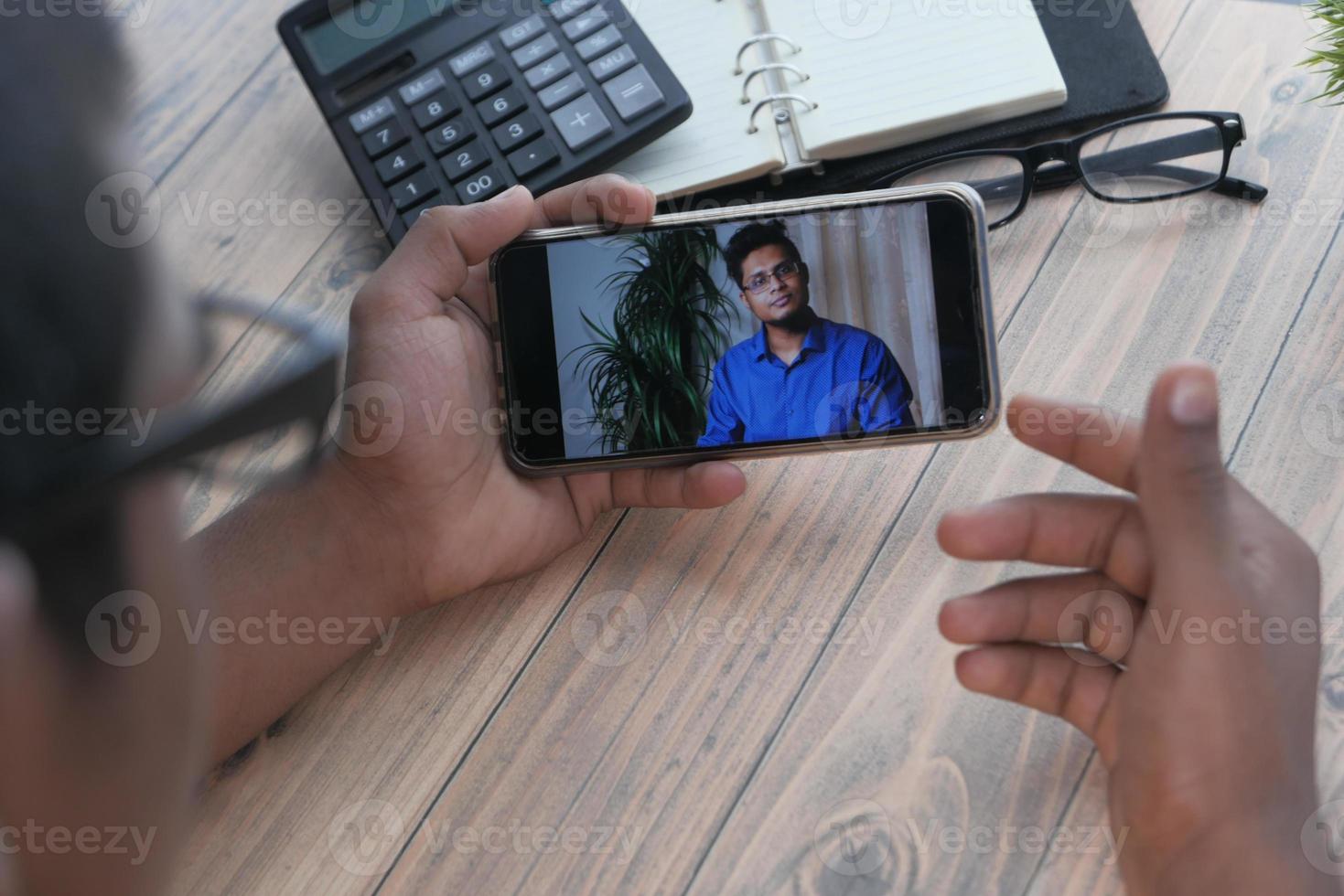 Businessman working in video conference photo