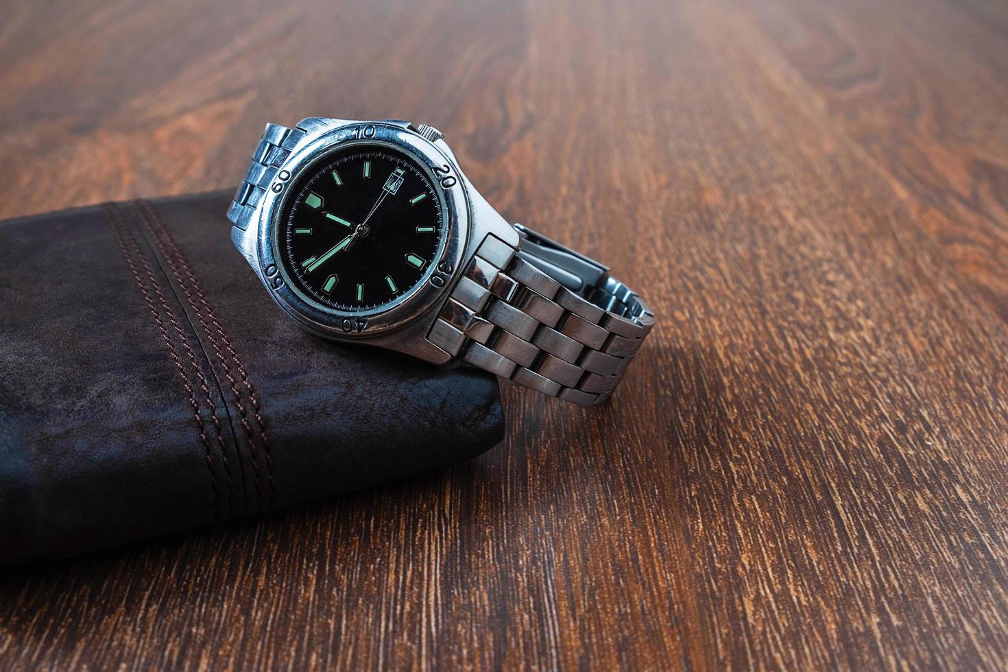 Wristwatch on a wallet photo