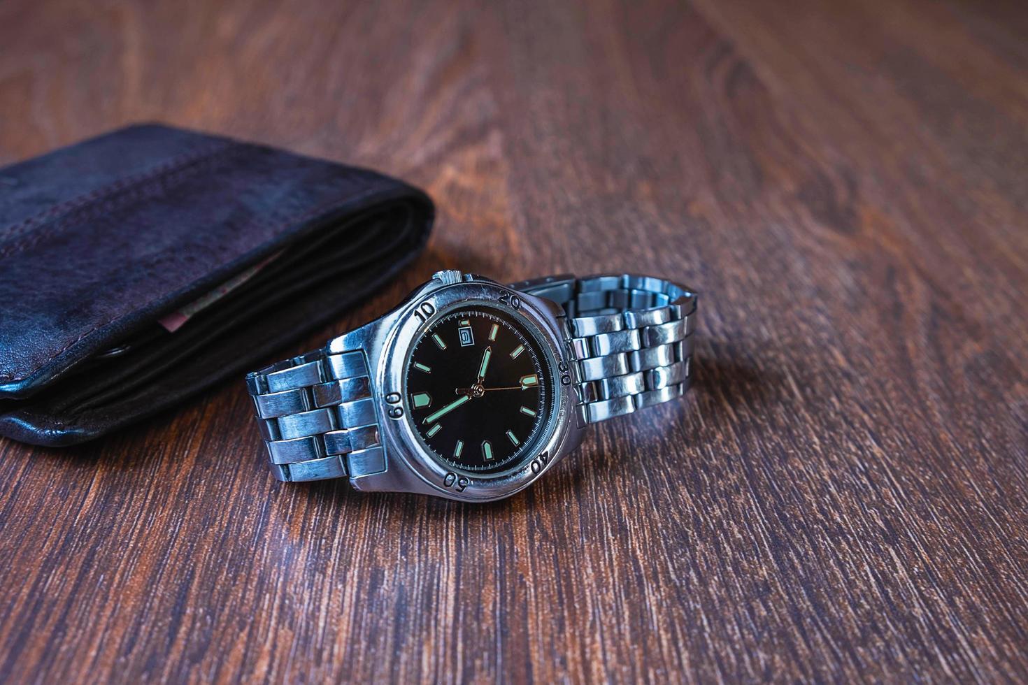 Wristwatch and a wallet photo
