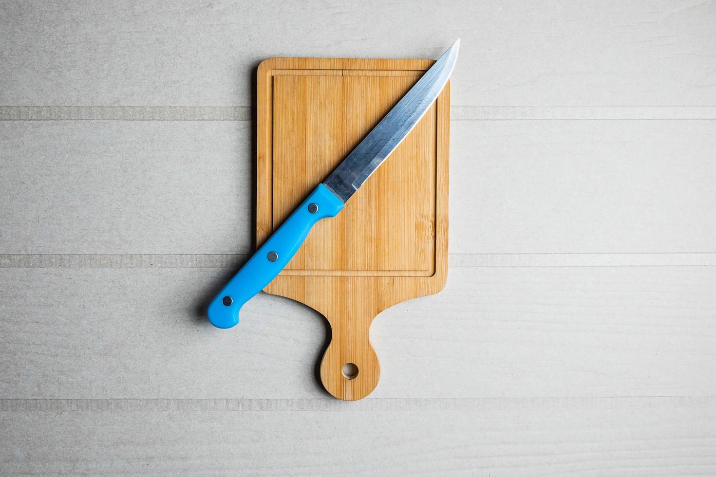 Cutting board and a knife photo