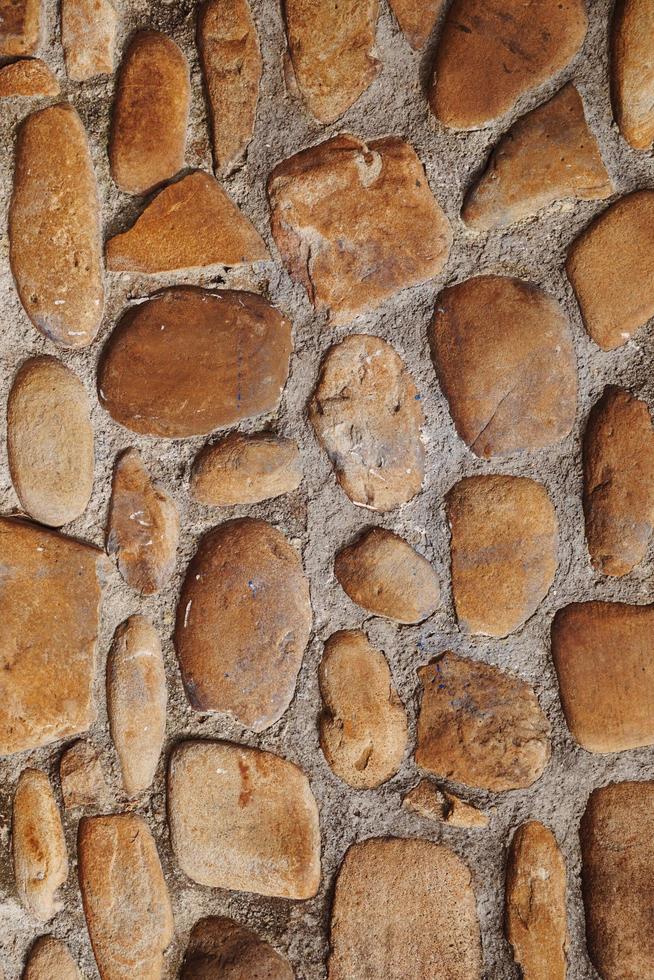 Fondo de textura de pared de piedra marrón foto