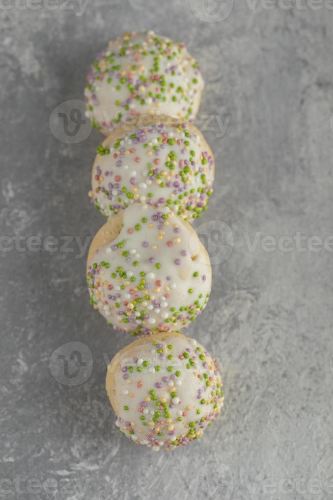 Set of sweet doughnuts with sprinkles photo