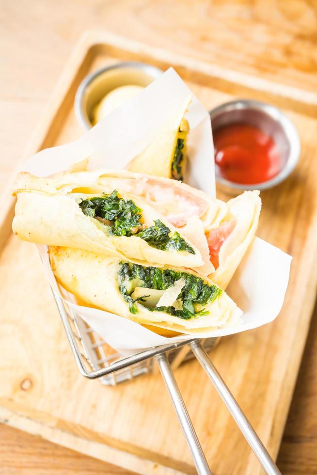 Fried spring roll with ham cheese and spinach vegetable photo
