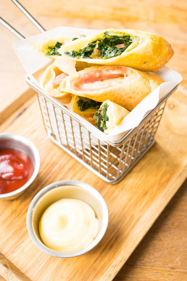 Fried spring roll with ham cheese and spinach vegetable photo