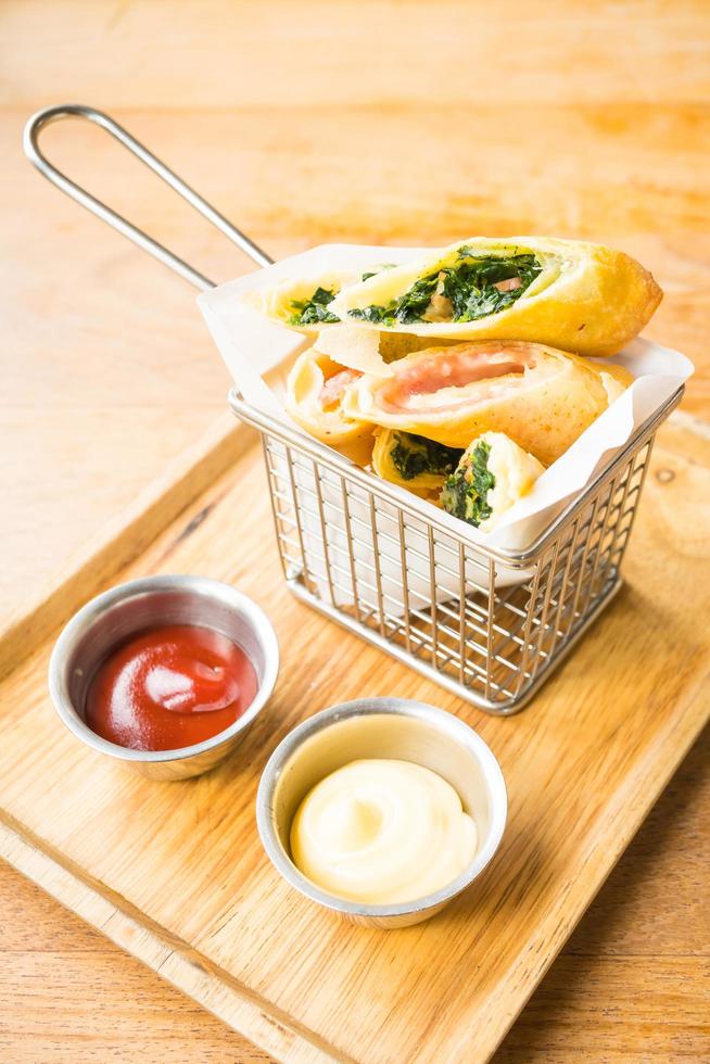 Fried spring roll with ham cheese and spinach vegetable photo