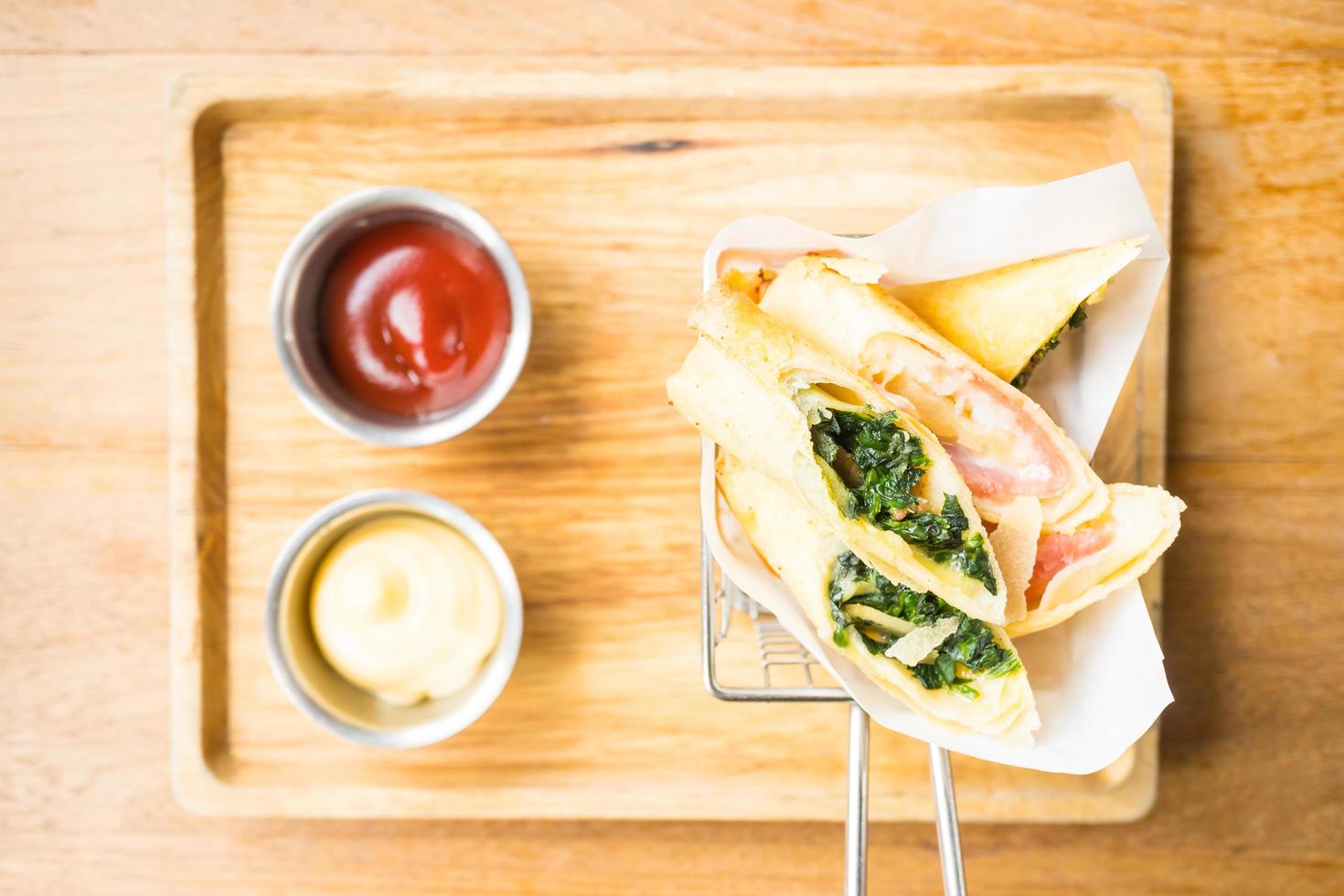 Fried spring roll with ham cheese and spinach vegetable photo