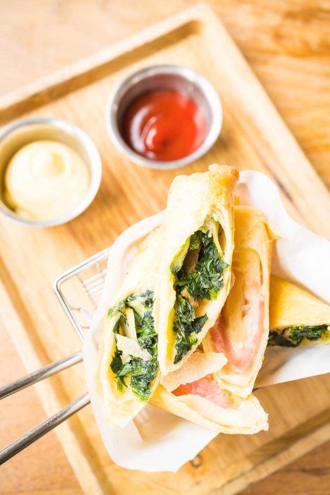 Fried spring roll with ham cheese and spinach vegetable photo