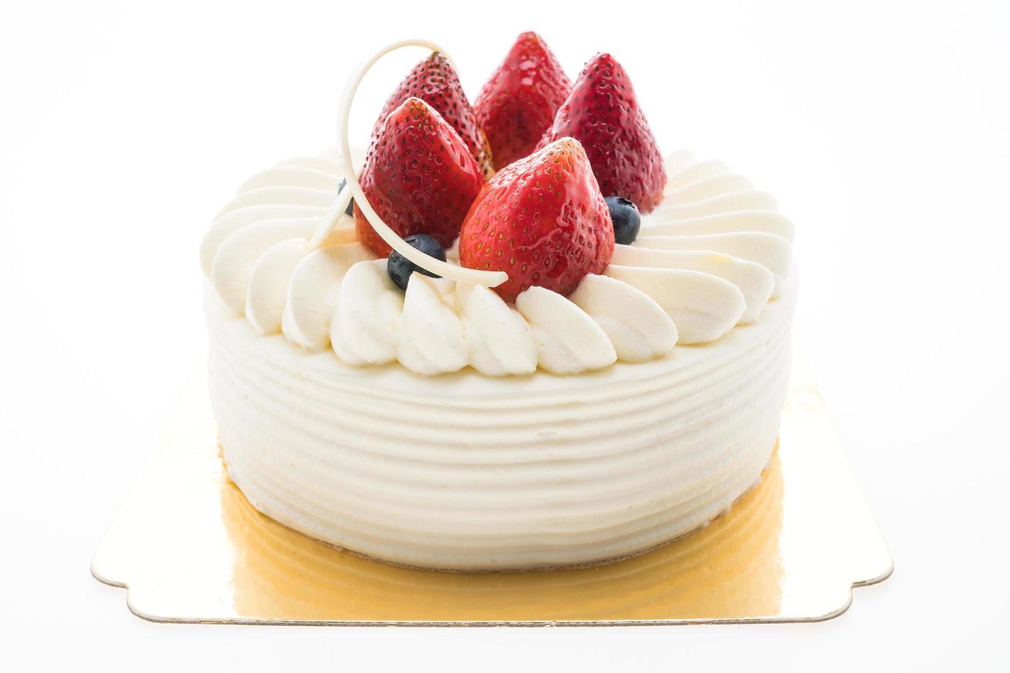 Vanilla cream cake with strawberry on top photo