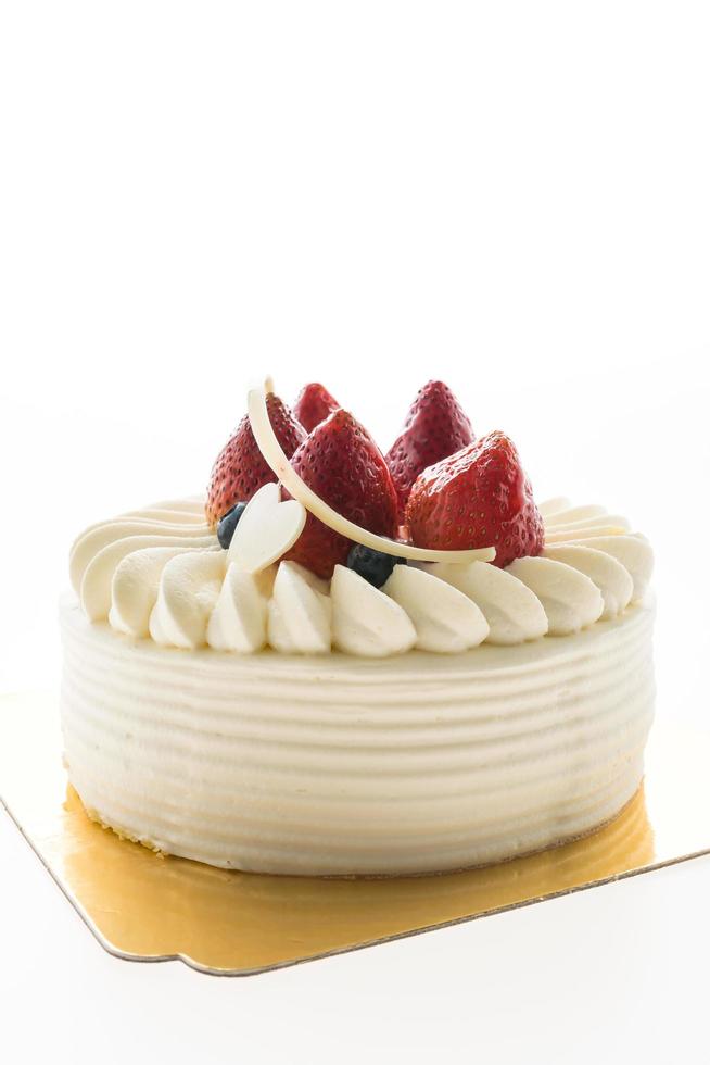 Vanilla cream cake with strawberry on top photo